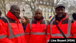 While joining colleagues to march in Paris on March 23, 2023, construction worker Djcounda Traore, right, said his job is too difficult to keep doing at 64.