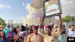 Supporters of Nigerien President Mohamed Bazoum gather to show their support for him in Niamey on July 26, 2023. 