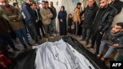 Palestinians mourn near the bodies of loved ones following Israeli bombardment on Rafah in the southern Gaza Strip, at al-Najar hospital on Friday February 16, 2024, amid ongoing battles between Israel and the Palestinian militant group, Hamas.