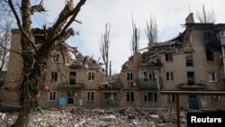 FILE - A residential building damaged by a Russian military strike is seen in the front-line city of Avdiivka, in Donetsk region, Ukraine, March 20, 2023.