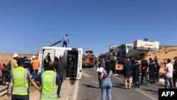 FILE: In an earlier road crash, rescuers and security forces gather at the scene of a bus crash on a motorway in Khouribga province, east of Morocco's economic capital, Casablanca, on August 17, 2022