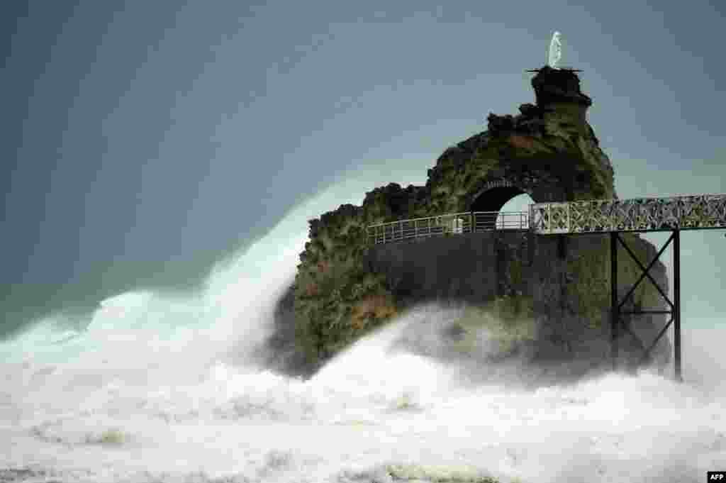 Waves crash on the "Rocher de La Vierge" (Virgin Rock) as Storm Ciaran hits the region, in Biarritz, southwestern France. At least 12 people were killed as Storm Ciaran battered Western Europe with record winds of up to 200 kilometers per hour.