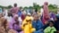 Nigerian Muslim women and children attend Eid al-Adha prayers at an open field in Lagos, June 28, 2023. African Muslim leaders meeting in Cameroon on July 14, 2023, said the idea that women should be allowed to carry out only domestic chores and farm work is an outdated.