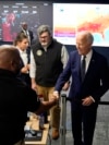 President Joe Biden greets people during a visit to the D.C. Emergency Operations Center, July 2, 2024, in Washington.