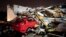 A car is buried under rubble on Main Street after a tornado hit Hendersonville, Tenn., Dec. 9, 2023.