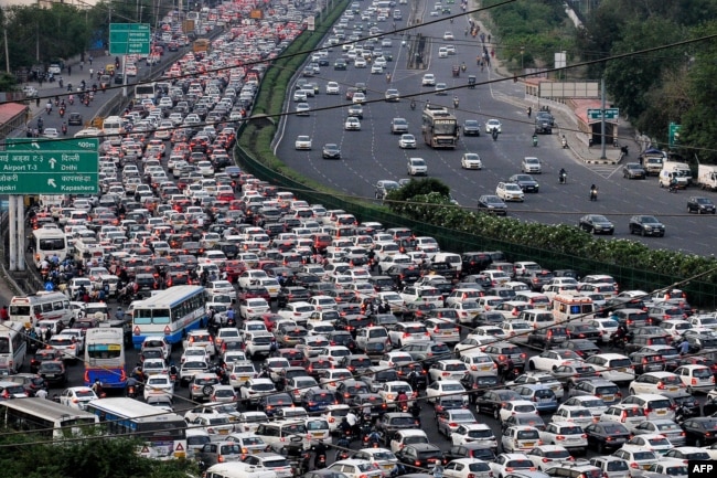 FILE - Vehicles are seen stuck in bumper-to-bumper traffic on the Delhi-Jaipur expressway in Gurgaon, India, April 25, 2023. (Photo by Vinay GUPTA / AFP)
