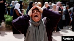 Tư liệu- Một người phụ nữ khóc than tại đám tang của 4 người Palestine thiệt mạng trong cuộc đụng độ với những người định cư Israel, gần Nablus ở Bờ Tây do Israel chiếm đóng, ngày 12 tháng 10 năm 2023.
