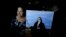 Rita Canteros poses for a picture alongside a painting depicting María Antonia de Paz y Figueroa, more commonly known by her Quechua name of 'Mama Antula,' on the outskirts of Buenos Aires, Argentina, Jan. 28, 2024. 