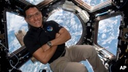 This image provided by NASA shows astronaut Frank Rubio floating inside the cupola, the International Space Station’s “window to the world.” Rubio now holds the record for the longest U.S. spaceflight. (NASA via AP)