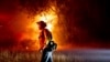 California firefighters gain ground against big wildfires after hot, windy weekend 