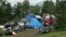 An outdoor tent city for the homeless is seen across from the city's historic railroad depot in downtown Anchorage, Alaska, July 26, 2023.