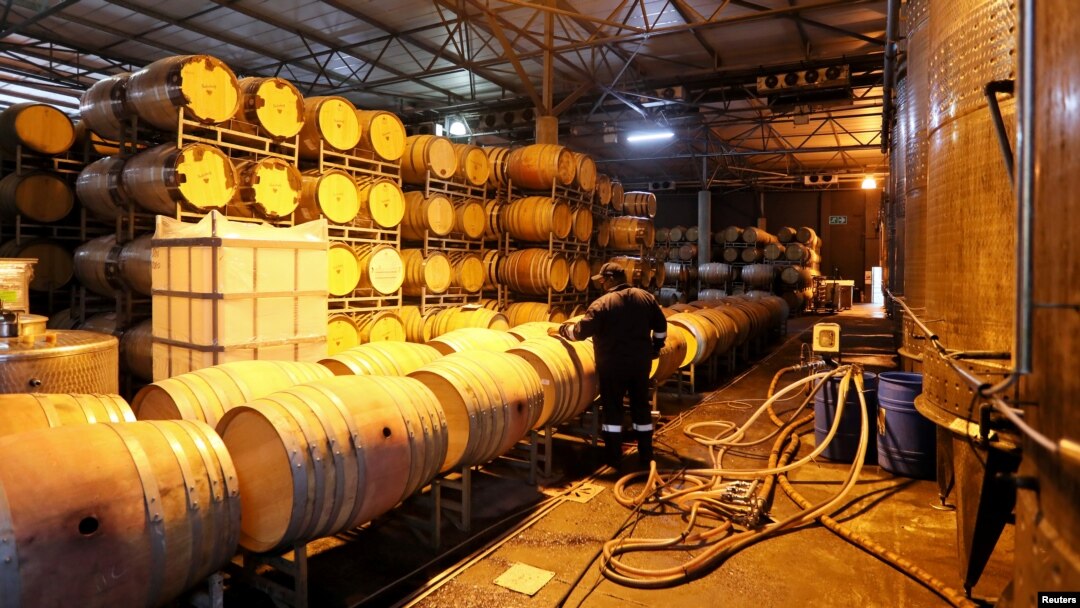 FILE - A worker prepares barrels for wine storage at Nederburg Wine Estate in Paarl, South Africa, July 8, 2020. Business leaders in South Africa worry about how the country's deteriorating relationship with the U.S. will impact the economy.