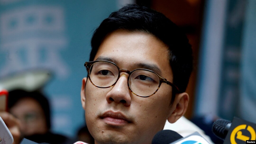 FILE - Pro-democracy activist Nathan Law is interviewed by journalists outside the Final Court of Appeal after being granted bail in Hong Kong, China Oct. 24, 2017. 