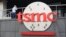 FILE - A person walks into the Taiwan Semiconductor Manufacturing Co., headquarters in Hsinchu, Taiwan, Oct. 20, 2021. 