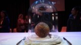 A meatball made using genetic code from a mammoth is seen at the Nemo science museum in Amsterdam, Tuesday March 28, 2023. (AP Photo/Mike Corder)