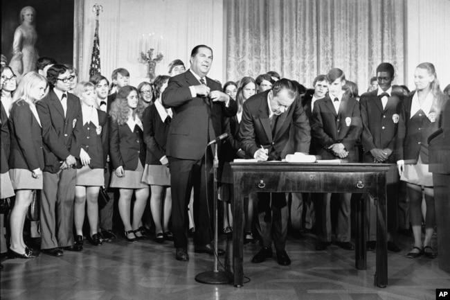 Graphic DescriptionFILE - President Richard Nixon signs the Constitution's newest amendment which guarantees 18-year-olds the right to vote in all elections in East Room of the White House in Washington on July 4, 1971. (AP Photo/Charles Tasnadi, File)