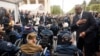 U.S. Defense Secretary Lloyd Austin, right, greets U.S. war veterans during a ceremony to mark the 79th anniversary of the liberation of France and Western Europe from Nazi control, at the American Cemetery in Colleville-sur-Mer, Normandy, France, June 6, 2023.