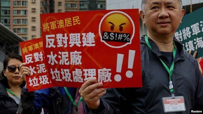 Protesters demonstrate against a land reclamation and waste transfer station project during one of the first demonstrations to be formally approved since the enactment of a sweeping national security law, in Hong Kong, March 26, 2023.