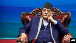 FILE- Nepalese Prime Minister Khadga Prassad Oli attends a signing of peace agreement in Kathmandu, Nepal, March 5, 2021. Oli, was named again prime minister on Sunday, following the collapse of a previous coalition government.