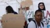 Members of the International Federation of Medical Students Associations hold placards during a protest demanding an end to fossil fuels at COP28 World Climate Summit, in Dubai, United Arab Emirates, Dec. 3, 2023.