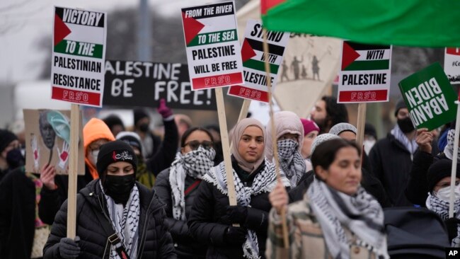 Pro-Palestinian demonstrators march during a visit by US President Joe Biden in Warren, Mich., Feb. 1, 2024.