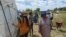 Zanu PF supporters milling outside a polling station in Bulawayo after they were disqualified from voting in the party's internal elections.