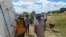 Zanu PF supporters milling outside a polling station in Bulawayo after they were disqualified from voting in the party's internal elections.