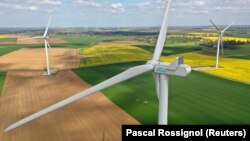 (FILE) An aerial view shows Engie Green power-generating windmill turbines in Saint-Hilaire-lez-Cambrai, France.