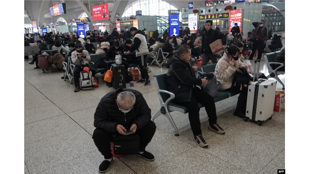 People are seen at Shijiazhuang train station on Feb. 6, 2024.
