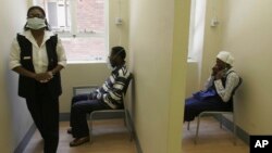 FILE - Patients use nebulizers during a test for the presence of TB, at the Tembalete, a U.S. funded Right to Care Clinic at the Helen Joseph Hospital in Johannesburg Wednesday, Dec 17, 2008.