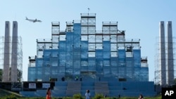 A giant stage built for the international World Youth Day stands in the center of Lisbon, Portugal, July 24, 2023.
