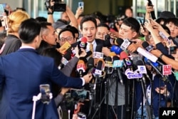 Former Thai prime ministerial candidate and ex-Move Forward Party leader Pita Limjaroenrat speaks outside the Constitutional Court in Bangkok, Jan. 24, 2024, after the court decided to reinstate him as a lawmaker.