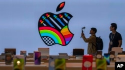 FILE - Apple iPhones are on display during a press preview of India's first Apple Store in Mumbai, April 17, 2023. 