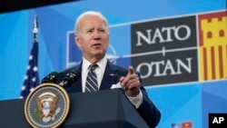 FILE - President Biden speaks during a news conference at a NATO summit in Madrid, June 30, 2022. He will head to Europe next week for a three-country swing in an effort to bolster the international coalition against Russian aggression in Ukraine.