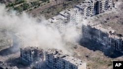 This photo provided to the AP by Ukraine's 24th Mechanised Brigade press service shows an aerial view of the town of Chasiv Yar, the site of heaviest battles with the Russian troops in the Donetsk region, Ukraine, July 3, 2024.