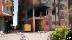 FILE: Residential buildings damaged in fighting are seen in Khartoum, Sudan, April 20, 2023. 