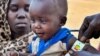 FILE- A child is examined for malnutrition in Renk County, Upper Nile state, South Sudan April 30, 2023. REUTERS/Jok Solomun REFILE - QUALITY REPEAT TPX IMAGES OF THE DAY.