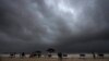 Rain clouds fill the sky at a mostly deserted beach ahead of Cyclone Biparjoy's landfall at Mandvi in Kutch district of Gujarat state, India, June 15, 2023. 