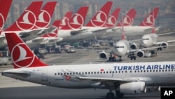 FILE - Turkish Airlines airplanes are parked at Ataturk International Airport, in Istanbul, April 5, 2019. Iranian media reported on July 9, 2024, that police in Iran closed the airline's Tehran office because its female employees refused to wear the hijab.