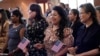 FILE - Women representing more than 20 countries take part in a Naturalization Ceremony, in San Antonio, March 8, 2024. The U.S. immigrant population from South and Central Asia is climbing.