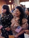 FILE - Women representing more than 20 countries take part in a Naturalization Ceremony, in San Antonio, March 8, 2024. The U.S. immigrant population from South and Central Asia is climbing.