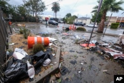 Debris is seen after a tornado damaged several buildings in Montebello, California, March 22, 2023.