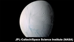 During a 2005 flyby, NASA’s Cassini spacecraft took high-resolution images of Enceladus that were combined into this mosaic, which shows the long fissures at the moon’s south pole that allow water from the subsurface ocean to escape into space.
