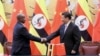 CRais wa Uganda Yoweri Museveni akipeana mkono na Rais wa China Xi Jinping huko Beijing. Picha na REUTERS