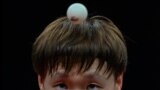 China's Wang Manyu hits a return against Japan's Miwa Harimoto in their women's team final table tennis match during the Hangzhou 2022 Asian Games in Hangzhou, in China's eastern Zhejiang province.