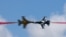 Members of South Korea's 'Black Eagle' aerobatics team perform during a preview of the Singapore Airshow in Singapore, Feb. 18, 2024. 
