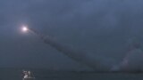Missiles being fired from a submarine at an undisclosed target in North Korea.