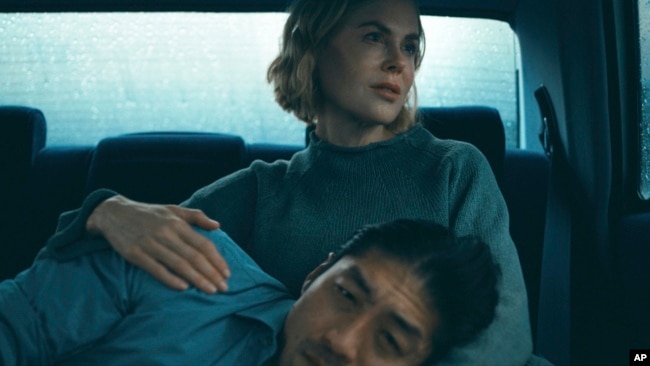 This image released by Prime Video shows Brian Tee and Nicole Kidman in a scene from 'The Expats.'