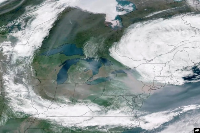 This GOES-16 GeoColor satellite image taken June 7, 2023, at 2:20 p.m. EDT and provided by CSU/CIRA & NOAA, shows a broad view of smoke from Canadian wildfires drifting across the Midwest and Northeast of the United States.