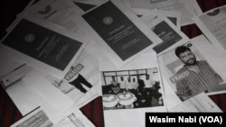 People display the printouts of bank transactions made by them into different accounts of Curative Survey Private Limited, which scammed people out of millions of dollars in Indian administered Kashmir. 